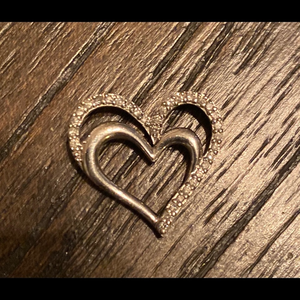 Sterling silver and diamond heart pendant.